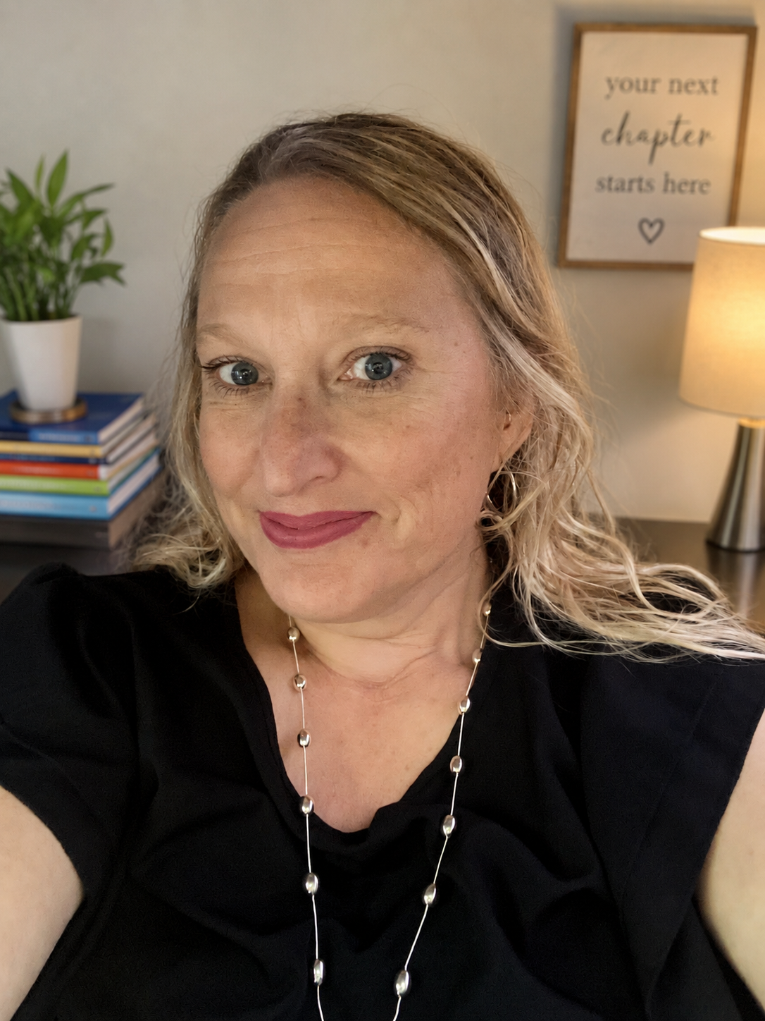 Laura, founder of Next Chapter AI, smiling in warm natural light